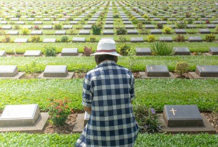 Man overlooking cemetery markers